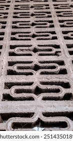 geometric pattern etched into a concrete surface