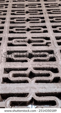 geometric pattern etched into a concrete surface