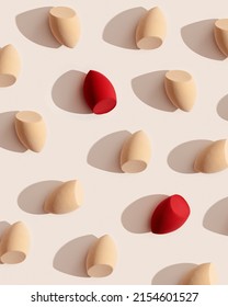 Geometric Pattern From Makeup Sponges For Foundation Cream On Beige Background With Dark Shadows. Beauty Blender Red And Beige. Fashion Flat Lay Cosmetic Sponge, Top View Graphic Layout, Vertical