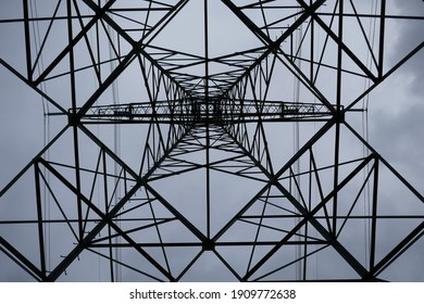 geometric pattern from position standing under electricity pylon