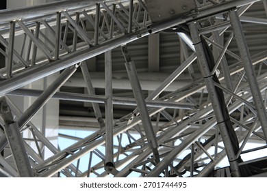 A geometric pattern of steel components welded together to create a supporting structure