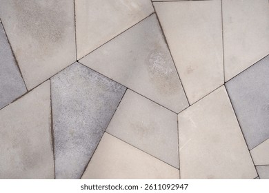 Geometric Paver Pattern, A close-up of a geometric paver pattern featuring polygonal tiles in neutral tones, creating a modern and stylish outdoor or indoor flooring design