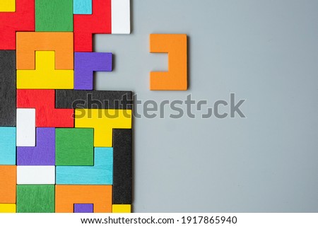 geometric shape block with colorful wood puzzle piece background. logical thinking, business logic, Conundrum, decision, solutions, rational, mission, success, goals and strategy concepts