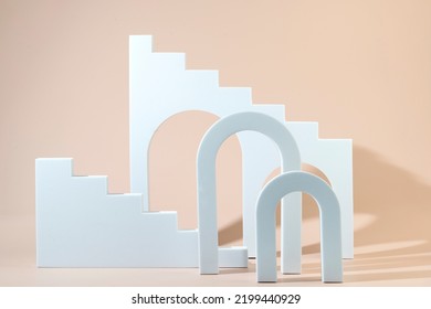 Geometric shapes stairs podiums and archs standing on a beige background - Shutterstock ID 2199440929