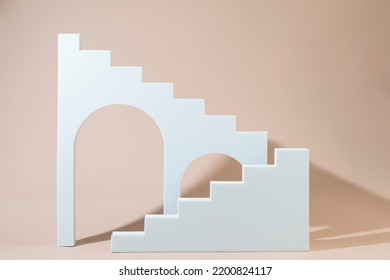 Geometric shapes stairs podiums and archs standing on a beige background