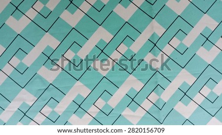 Geometric wallpaper, The design features an abstract pattern with interlocking diamond shapes in aqua blue or light green and white. 