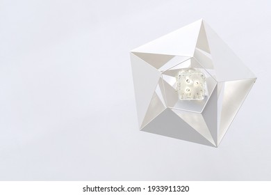 Geometric White Modern Metal Chandelier Hanging From The White Ceiling, Bottom View. 