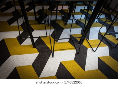 Geometrical Escher Pattern Flooring  With Chairs