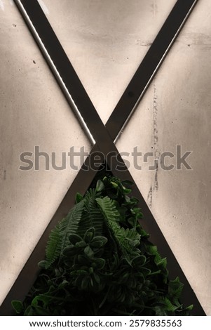 geometricart wall with lighting and green wall elements in city building