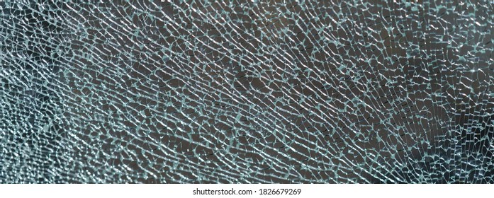 The Geometry Of The Cracking Glass. Glass Breaking Symmetry. The Glass Surface. White And Gray Colors. Suitable As Natural Background. Free Space For Message