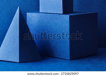 Geometry form platonic solids concept. Figures prism pyramid tetrahedron rectangular cube objects on blue background.