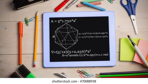 geometry problem against students table with school supplies