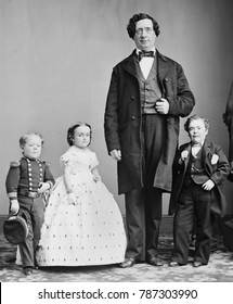 George Nut, Charles Stratton , Lavinia Warren Stratton, and The Giant, c. 1863-65. All were performers for P.T. Barnums AMERICAN MUSEUM in New York City