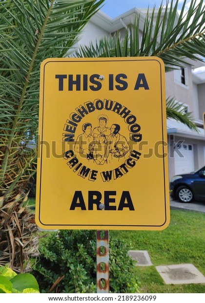 George Town, Cayman Islands - July 22, 2022:\
Neighborhood Crime Watch area sign in the residence area in George\
Town of Grand Cayman Island\
