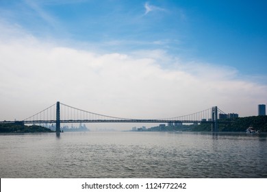 The George Washington Bridge is a double-decked suspension bridge spanning the Hudson River. The bridge connects the Washington Heights of Manhattan in New York City with Fort Lee in New Jersey.