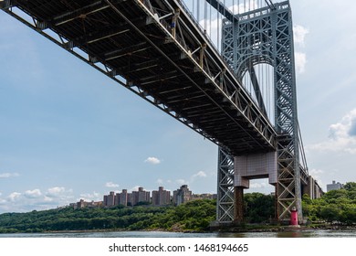 The George Washington Bridge is a double-decked suspension bridge across the Hudson River and connecting the Washington Heights of Manhattan with the borough of Fort Lee in New Jersey.
