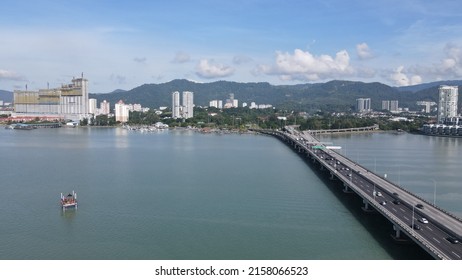 Georgetown, Penang Malaysia - May 18, 2022: The Majestic Penang Bridge, the iconic long bridge connecting Georgetown of Penang Island to the Mainland city of Butterworth.