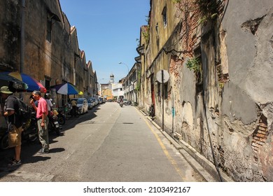 Georgetown, Penang, Malaysia - November 2012: A narrow alley passing through decaying walls in the old town of George Town in Penang.