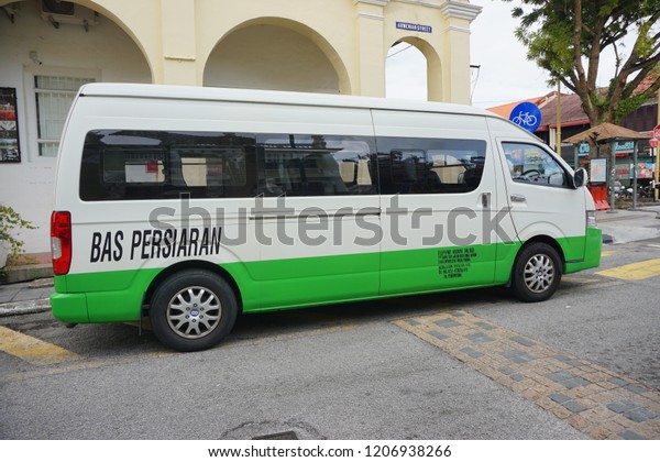 Georgetown, Penang,\
Malaysia - October 19, 2018 : Tourist van pictured on October 19,\
2018 in Penang. Tourist van must be painted in white with green\
stripe in\
Sabah,Malaysia.