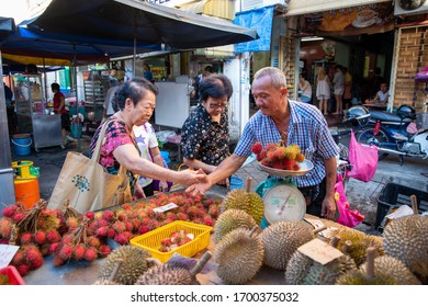 Georgetown, Penang/Malaysia - Jul 30 2016: Hawker Sell Durian And Rambutan At Stall.