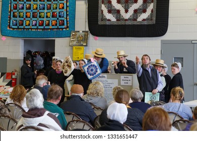 GEORGETOWN, PENNSYLVANIA - March 2, 2019: Amish volunteers help at the annual quilt and craft auction which benefits the Fire Company.