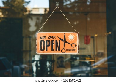 Georgia, Tbilisi, February 25, 2020: Retro signboard We are open barber shop at the entrance to the trendy city barber shop - Shutterstock ID 1681591702