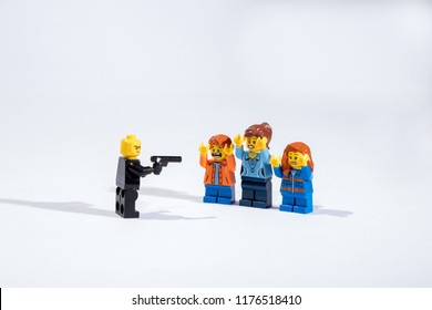 Georgia, USA - Sep 07, 2018: People or Family being mugged or robbery concept. Mini figures mugging up or arresting. Lego is a popular brand of mini figures. Lego Company is based in Denmark. - Shutterstock ID 1176518410