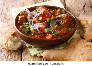Georgian beef stew with spices in tomato sauce close-up in a bowl on the table. horizontal - Shutterstock ID 1610580520