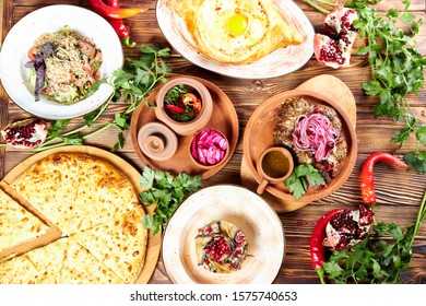 Georgian national cuisine, lots of vegetables and meat - Shutterstock ID 1575740653