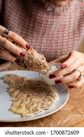 Georgian Plain Tandoori Flatbread Mchadi, Woman Is Eating Scone With Hands, Tearing It In Pieces, Hands Only Visible