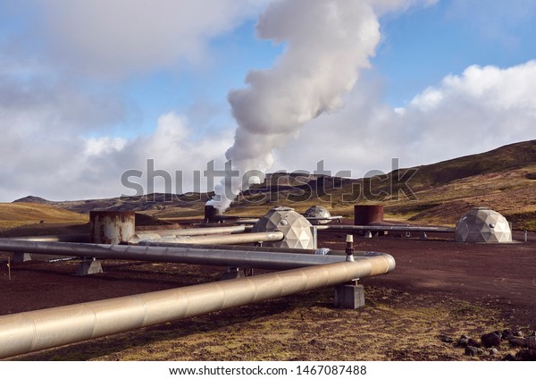 Geothermal energy production site in the north of\
Iceland, surreal space colony base landscape with red soil and\
steam coming out of the\
pipes