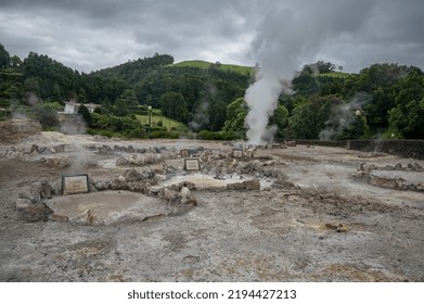 Geothermal Hot Springs Below Lush Green Hills