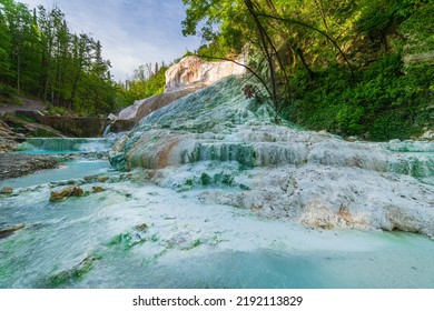 Geothermal Pool And Hot Spring In Tuscany, Italy. Bagni San Filippo Natural Thermal Waterfall In The Morning With No People. The White Whale Amidst Forest.