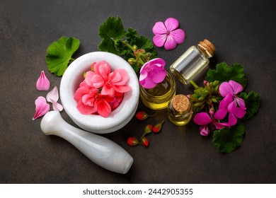 Geranium flower and geranium essential oil - Powered by Shutterstock