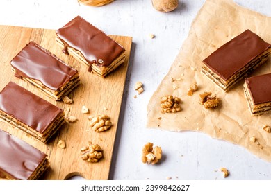 Gerbeaud Cake. Zserbo. Traditional Hungarian multi-layer cake with plum jam, nuts and covered with chocolate glaze - Powered by Shutterstock