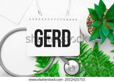 gerd word on notebook,stethoscope and green plant