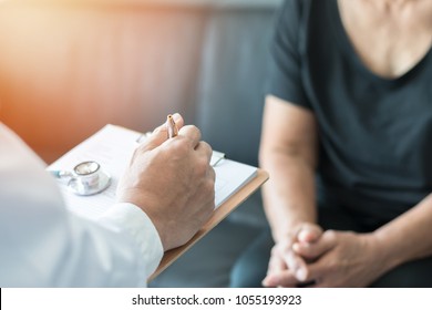 Geriatric Doctor (geriatrician) Consulting And Diagnostic Examining Elderly Senior Adult Patient (older Person) On Aging And Mental Health Care In Medical Clinic Office Or Hospital Examination Room