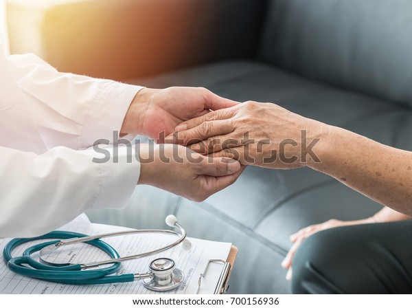 Geriatric doctor (geriatrician) consulting and\
diagnostic examining elderly senior adult patient (older person) on\
aging and mental health care in medical clinic office or hospital\
examination room  