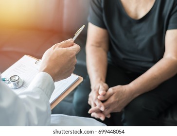 Geriatric Doctor (geriatrician) Diagnostic Examining Elderly Senior Or Woman Adult Patient (older Person) On Aging And Mental Health Care In Medical Clinic Office Or Hospital Examination Room 