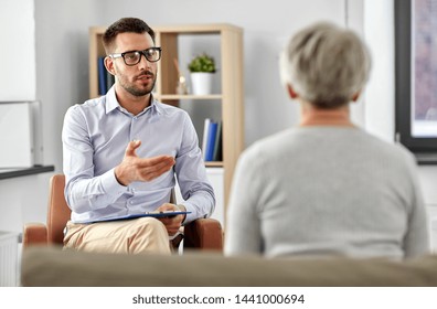 Geriatric Psychology, Mental Therapy And Old Age Concept - Psychologist Talking To Senior Woman Patient At Psychotherapy Session