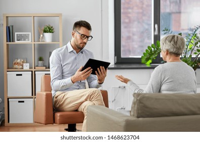 Geriatric Psychology, Mental Therapy And Old Age Concept - Psychologist With Tablet Computer And Senior Woman Patient At Psychotherapy Session