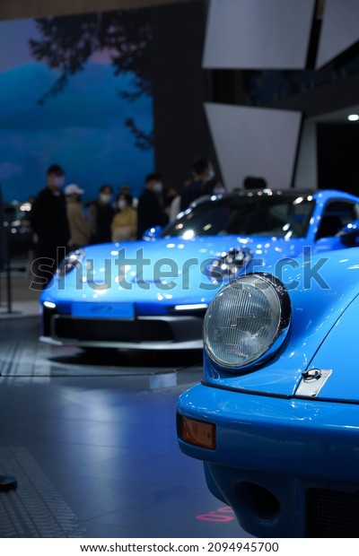 The German automobile company Porsche 911 GT3\
model displayed on the motor show. The Porsche 911 GT3 is an\
ultra-high performance lineup of\
911.