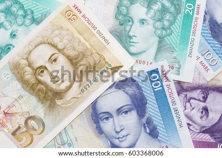 German banknotes. Deutche Mark (DM) D-mark in denominations 10, 20, 50 and 100. Pre-euro currency money which now are cancelled and invalid.