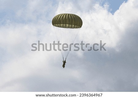 German Bundeswehr paratroopers in camouflage during a parachute jump ストックフォト © 