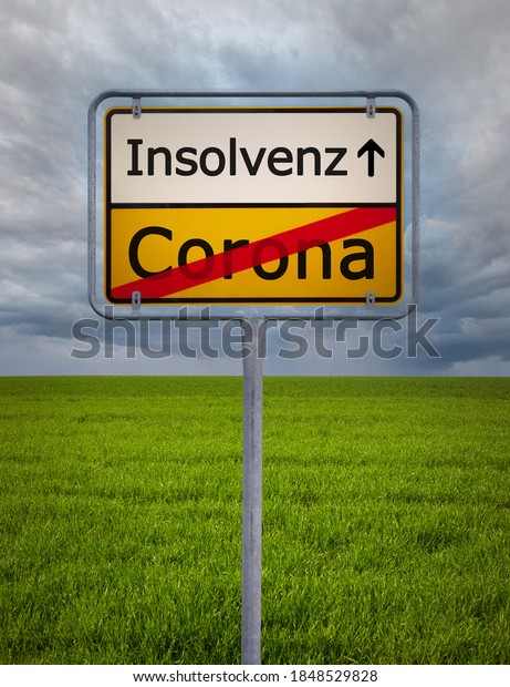 A german city sign with the text\
corona insolvenz - corona bankruptcy in german\
language