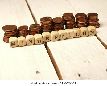 German Concept Image With The Words Minimum Wage On Wooden Dices