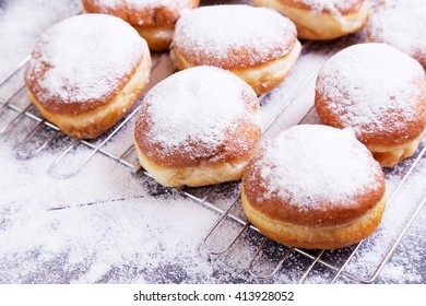 German donuts - berliner with icing sugar on a dark wooden table - Powered by Shutterstock