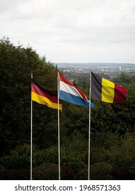 German Dutch And Belgian Flags Waving In The Wind At Triple Border Point Drielandenpunt Les Trois Bornes Dreilandereck On Vaalserberg Germany Netherlands Belgium Europe