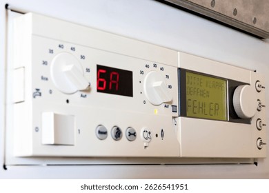 German error message on the control unit of a condensing gas boiler (translation: please open flap - error)