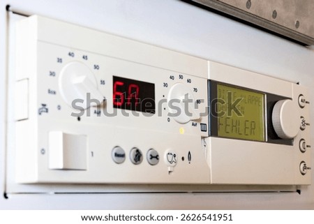 German error message on the control unit of a condensing gas boiler (translation: please open flap - error)